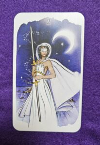 Arcano 2 de Espadas do Tarot The Unfolding Path